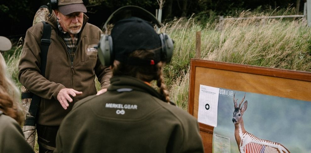 looking at a notice board with a picture of a stag