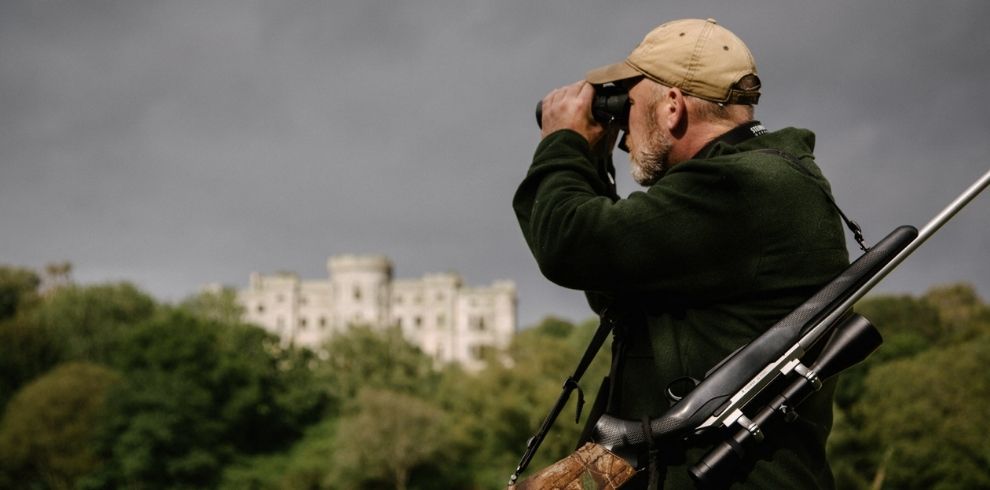 A person looking through binoculars