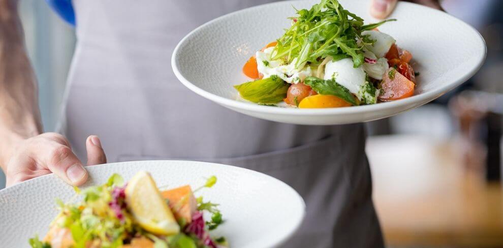 A waiter with well presented dishes