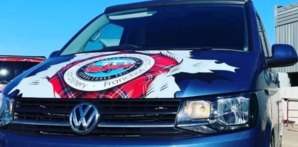 bonnet of campervan with tartan campervan company logo