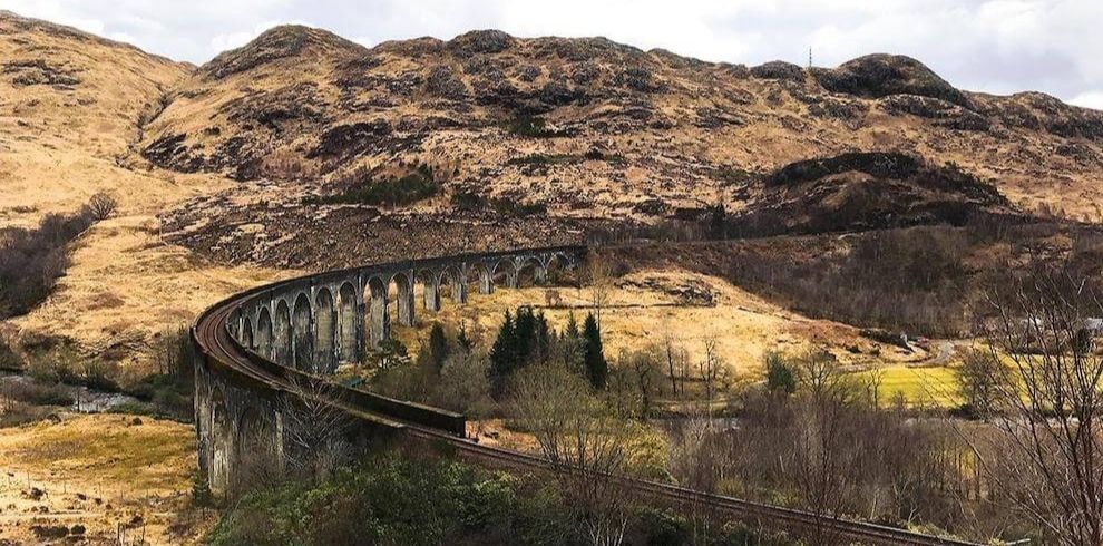 railway line going through a mountain glen