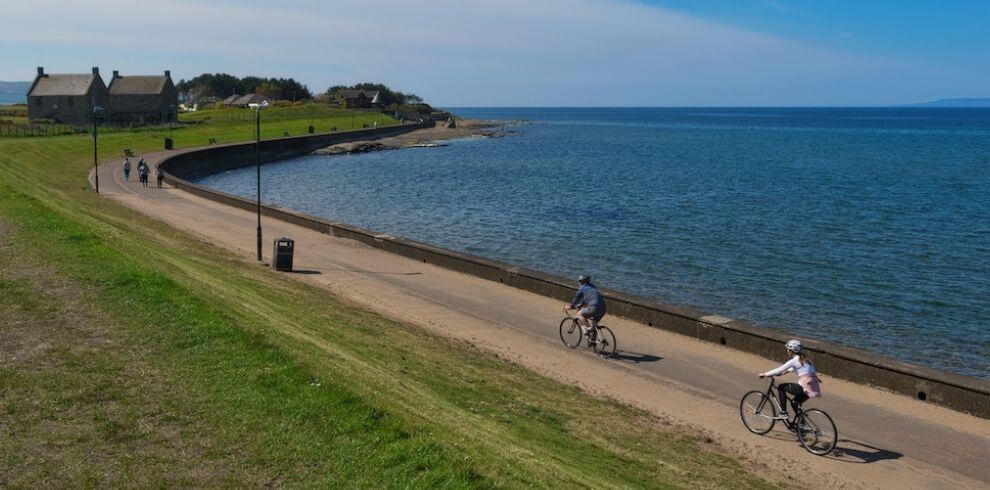 Prestwick beach people cycling on promenade