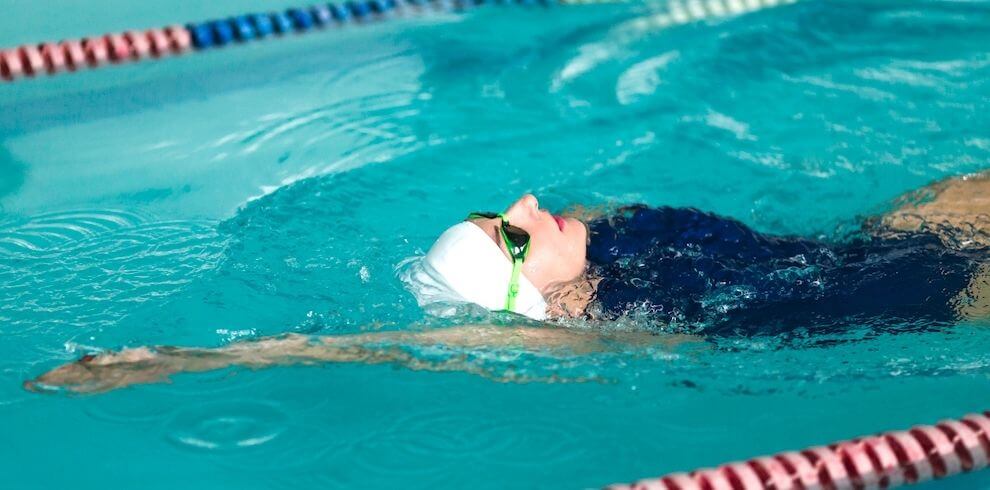 Person swimming on their back