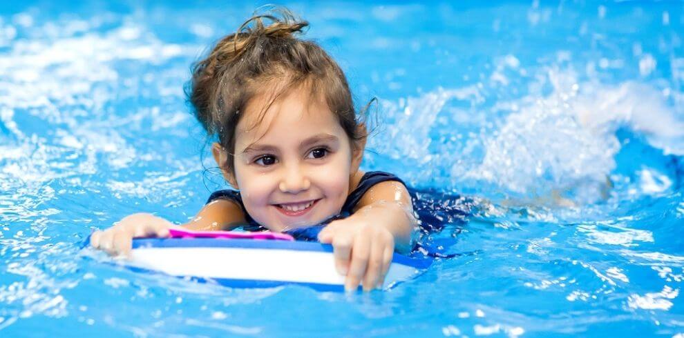 Girl with a float in pool