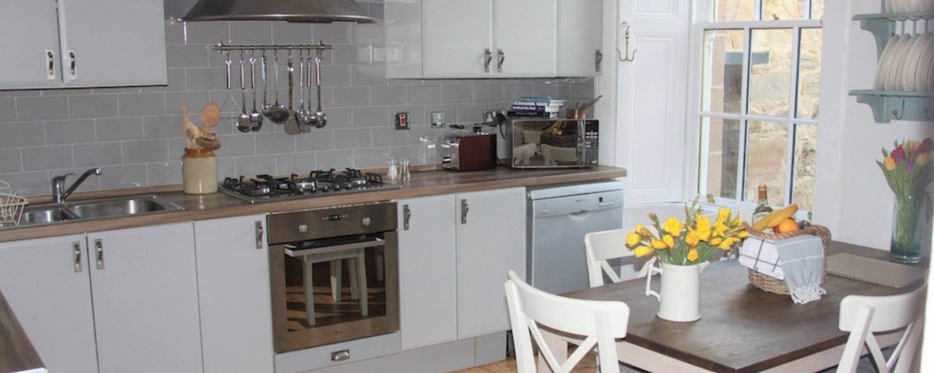 Modern, clean kitchen and seating area.