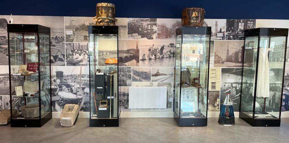 Display cabinets featuring various collection items and artefacts.