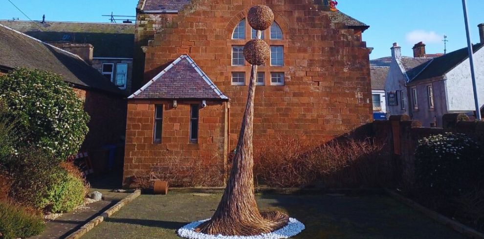 Rear view of the McKechnie Institute, with willow sculpture by David Powell.