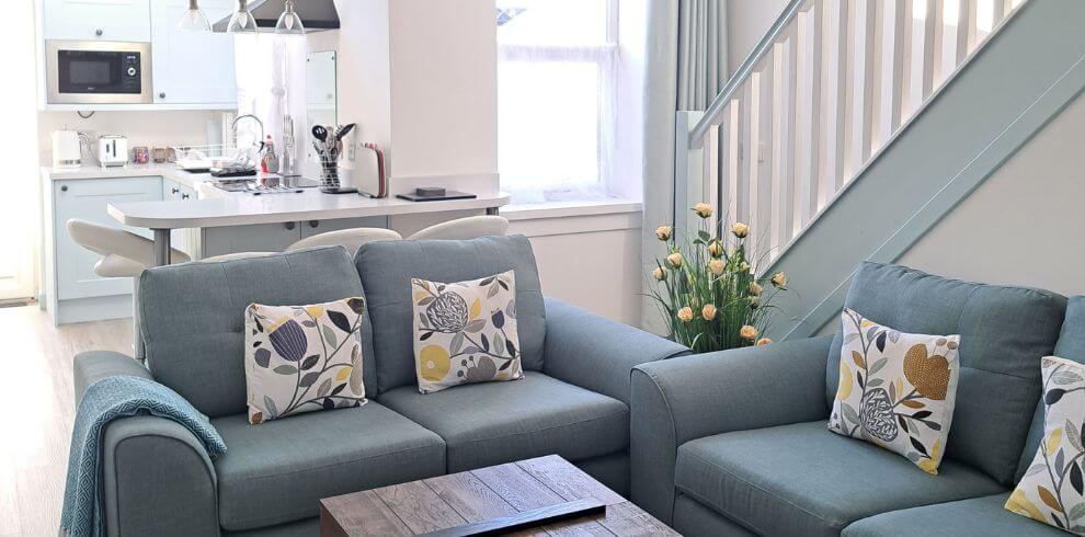 Soft blue couches in a sitting room.