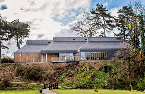 Image of Belleisle Clubhouse with trees surrounding.