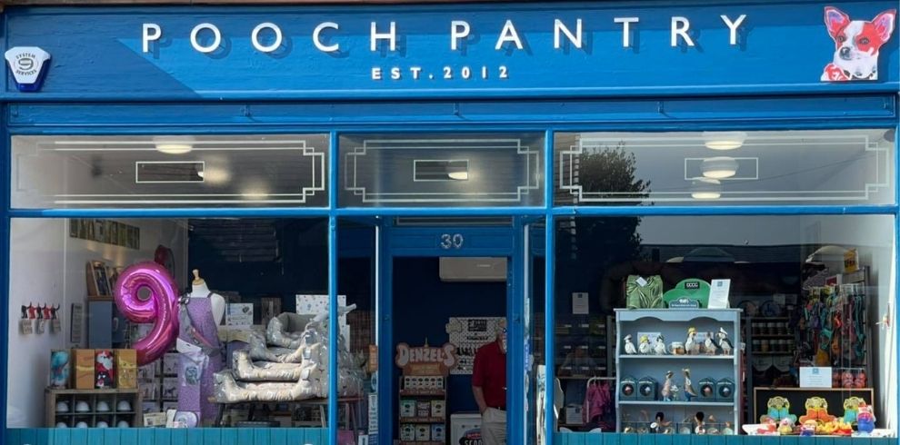 blue shop frontage with pooch pantry sign. Lovely window display