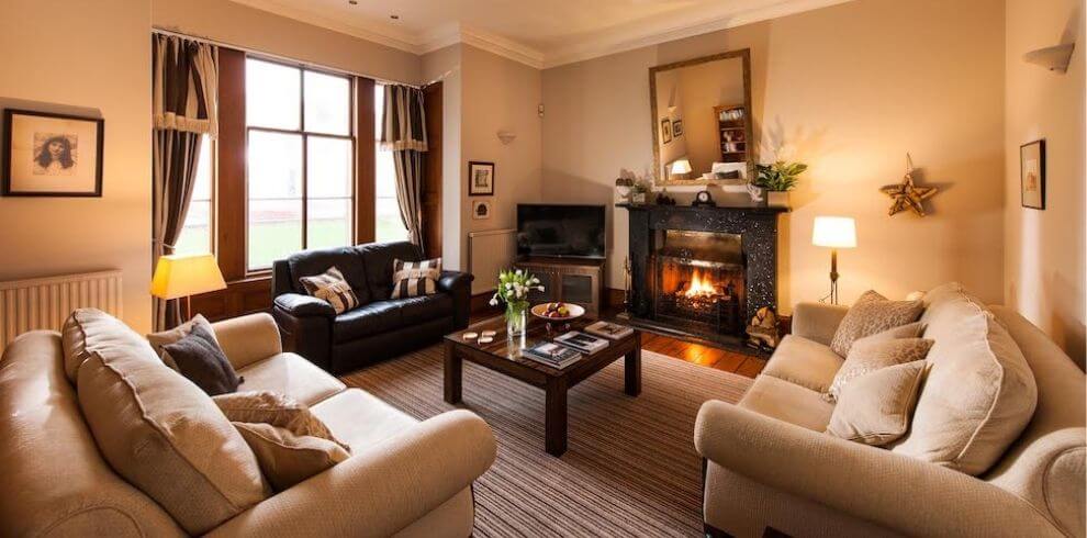 stylish livingroom with sofas a fireplace