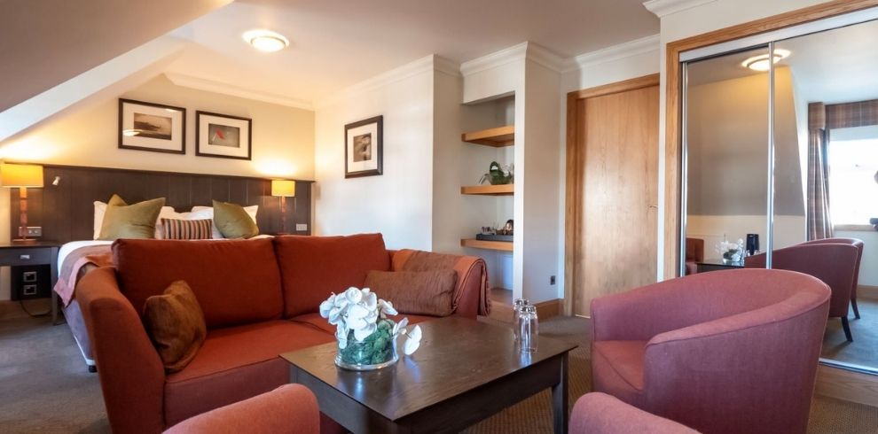 An image of a seating area in a hotel room.