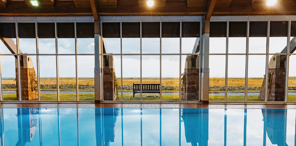 Swimming pool with views to a golf course.