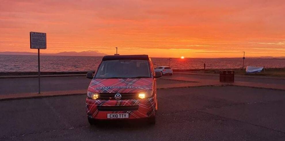 campervan with a sunset in the background