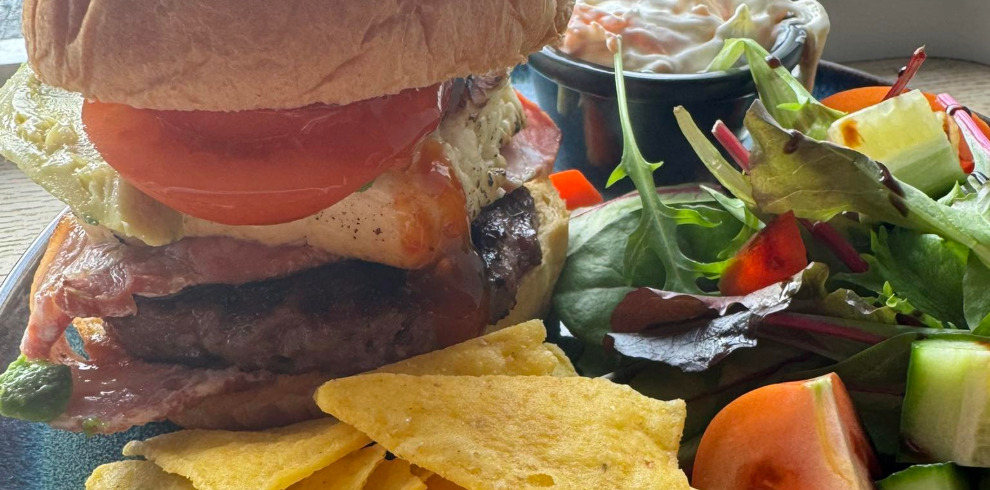 Plate of burger and crisps.