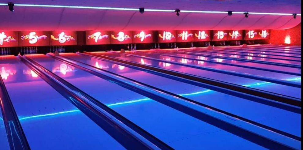 Brightly lit bowling lanes.