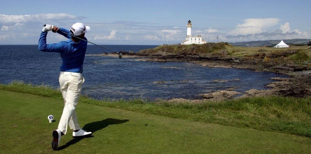 Golfer playing on the trump turnberry golf course looking at the lighthouse