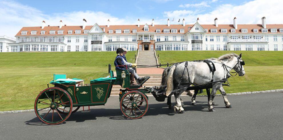 Horse drawn carriage with Turnberry Hotel in the background.