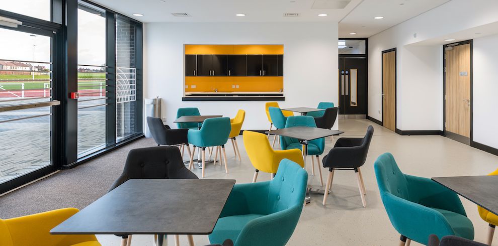 Reception area with, modern brightly coloured seating area.