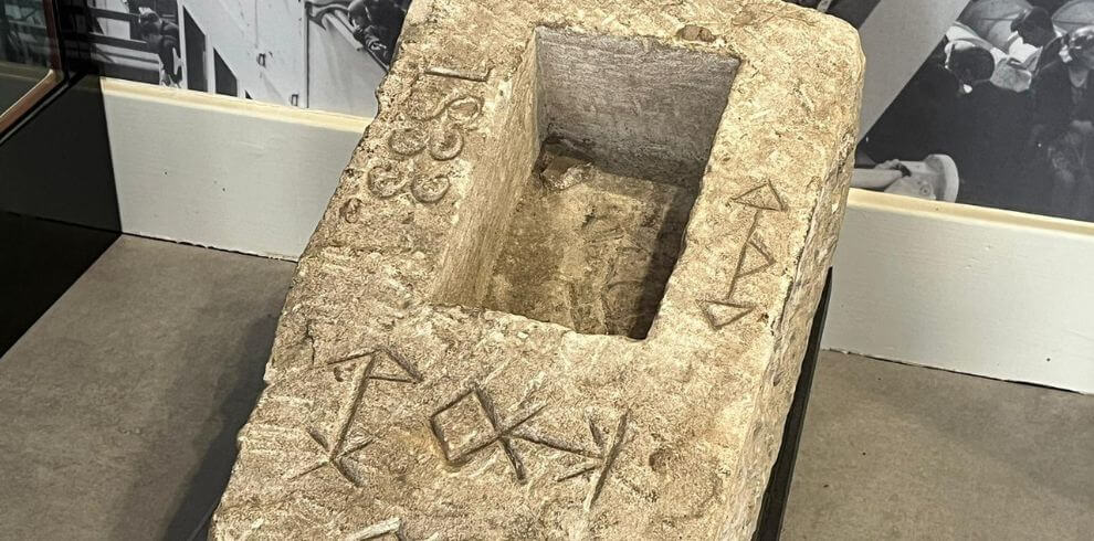 Stone masonary with unusual lettering and symbols.