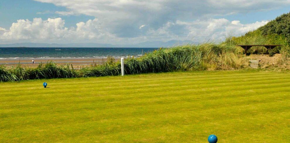 Troon golf course with the beach in the distance.