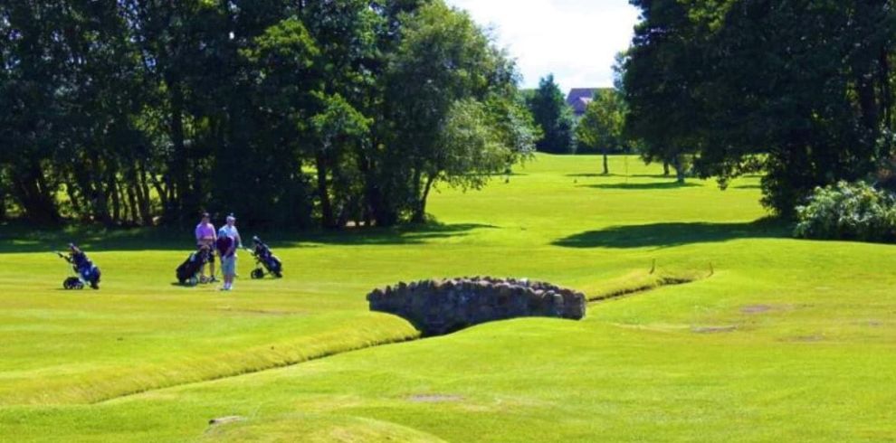 Image of golfers playing golf on Prestwick St Cuthbert golf course.