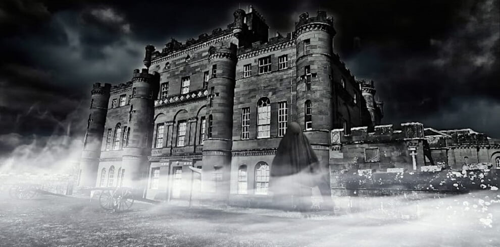 Picture of Culzean Castle in the dark looking spooky with a ghost floating and dressed in a black robe.