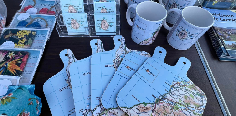 An image of mugs and coasters with maps on them.