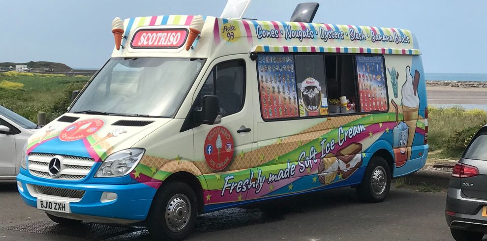 Image of an ice cream van parked on a road.