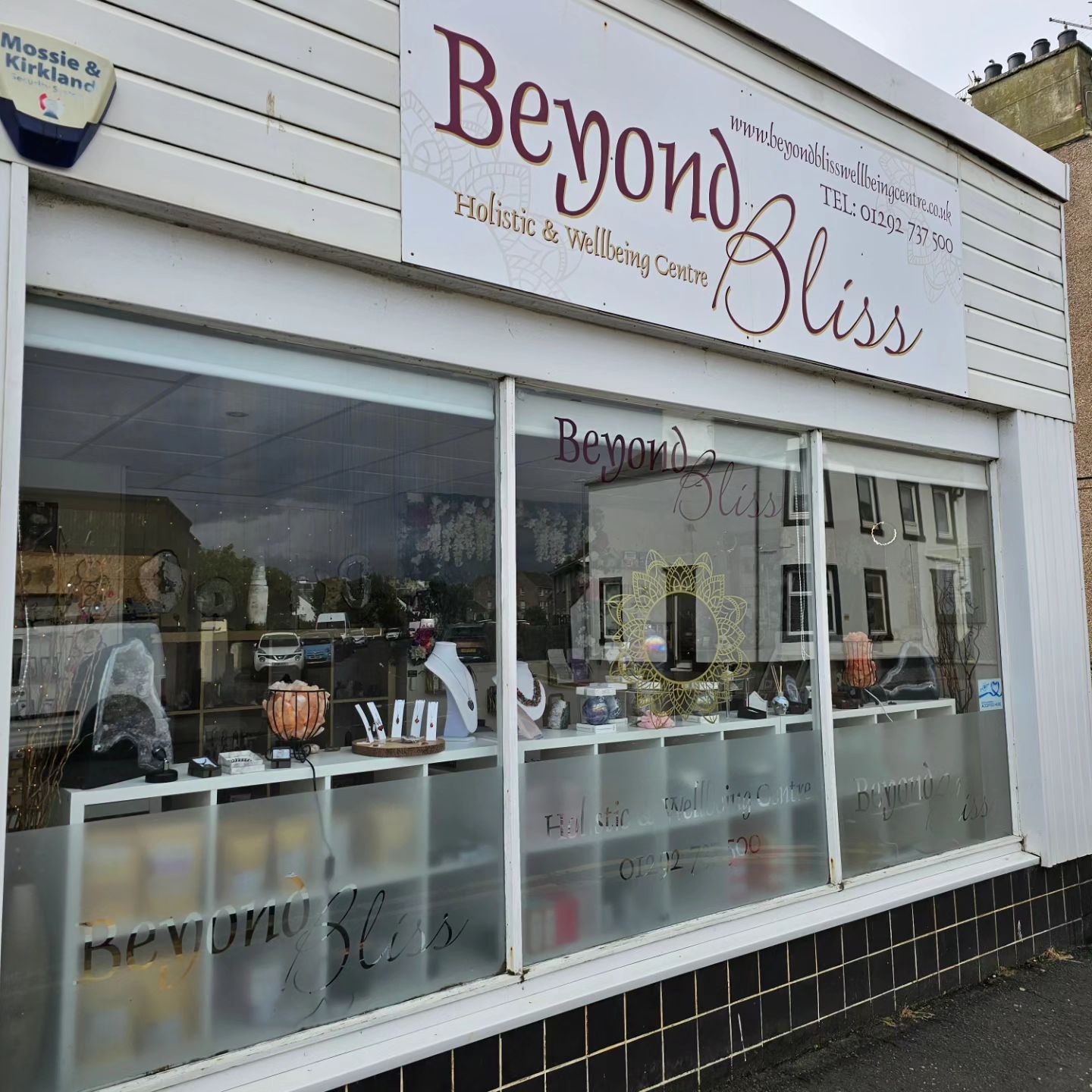 Beyond Bliss shop front showing a range of crystals for sale.