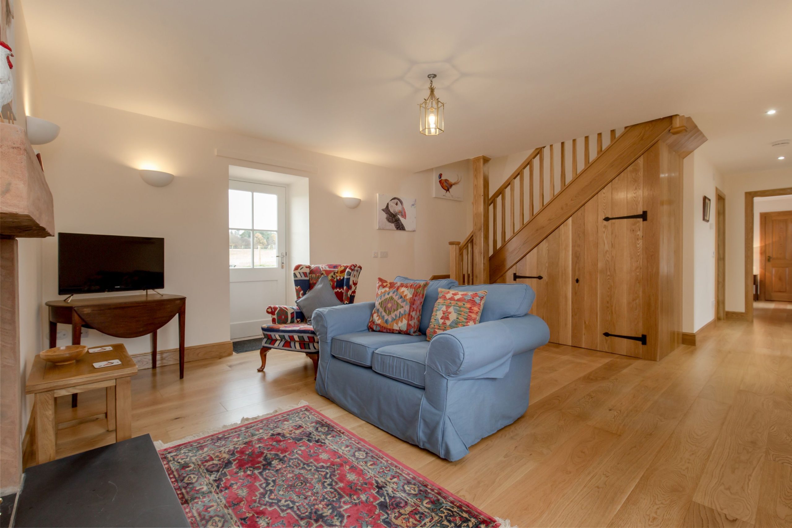 An image of a staircase and a sofa.