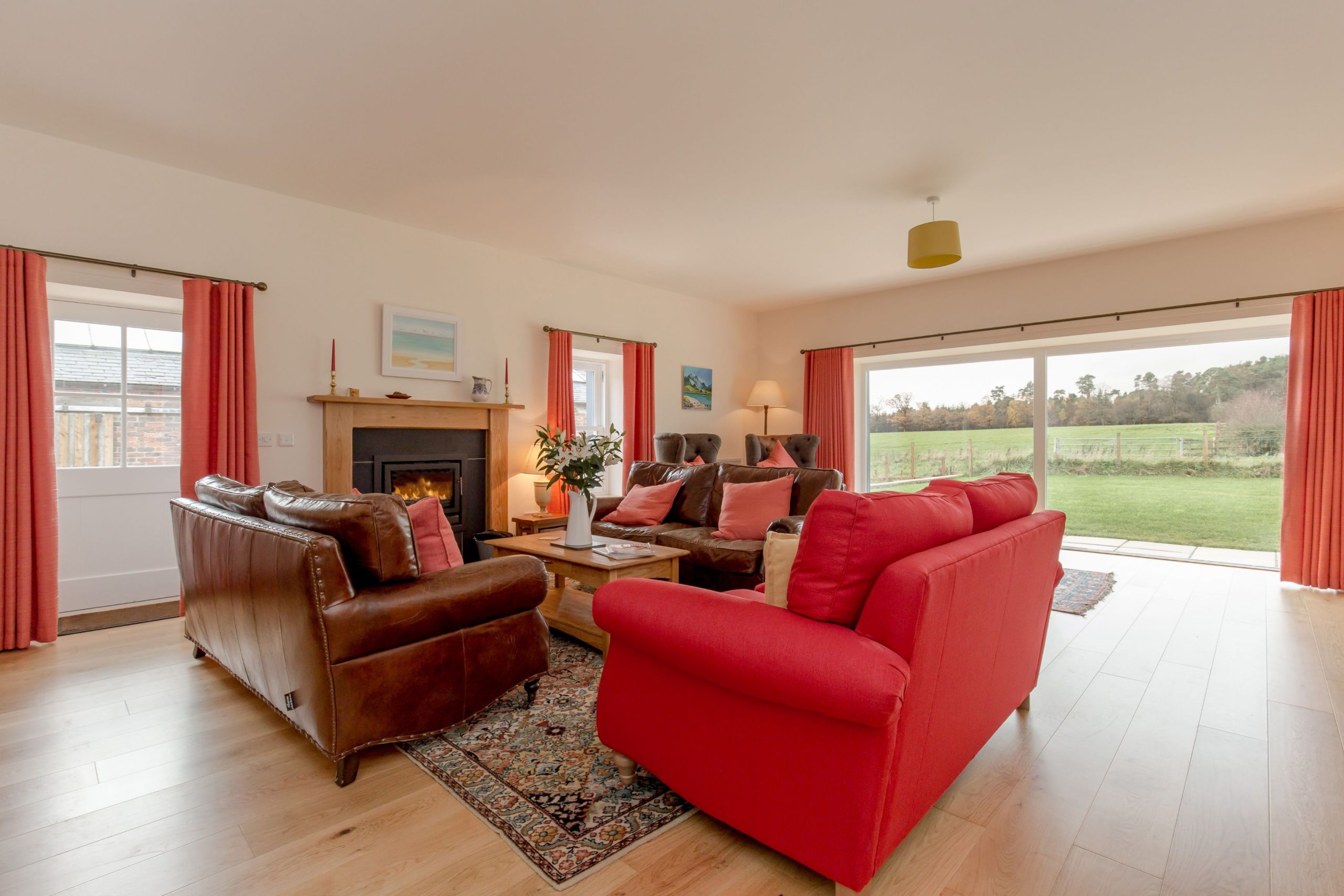 An image of a lounge with chairs and sofas.