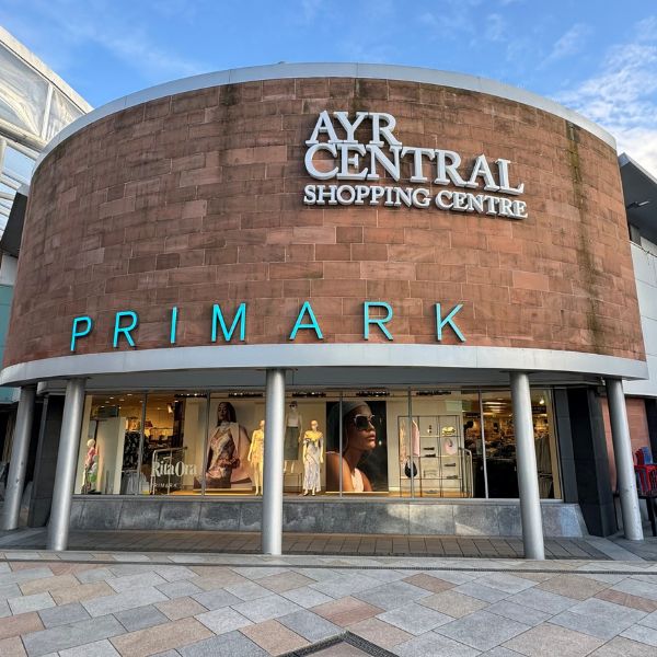 Exterior brick wall and shop front. Ayr Central.