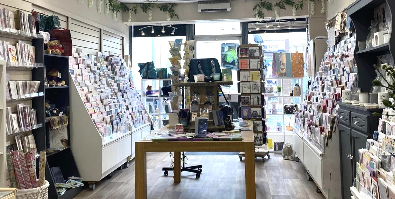 A picture of the display in the shop Twit Twoo. Shows candles and gifts.