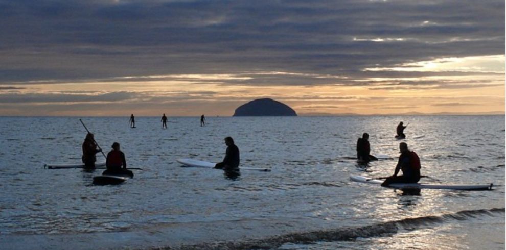 People enjoying water sports in the sea.