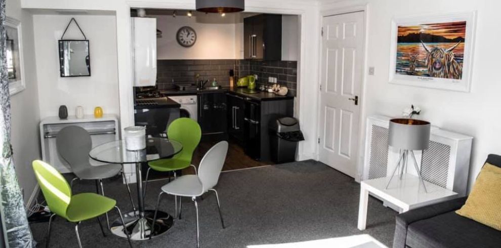 An image of a open plan kitchen/dining area.