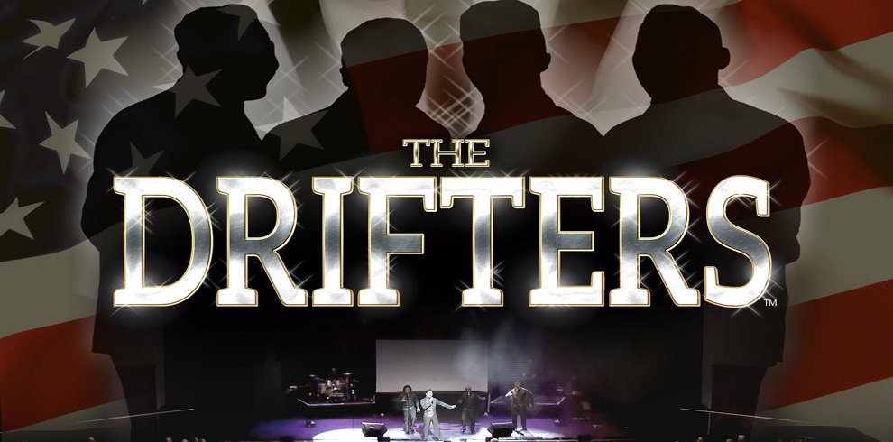 A picture of the drifters performing on stage and the heading saying the drifters in gold font.