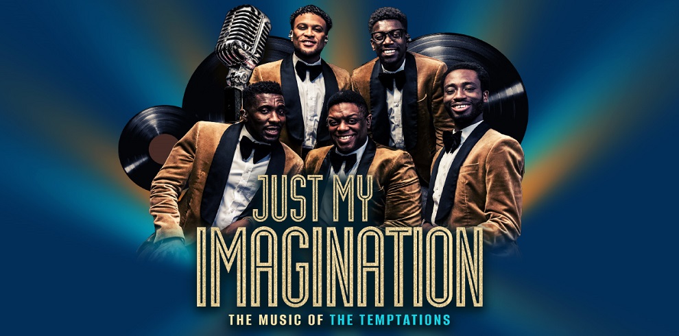 Promotional image for the theatre production Just My Imagination: The Music of The Temptations. Five performers dressed in matching golden velvet blazers with black bow ties smile warmly, evoking the iconic style of The Temptations. Behind them are oversized vinyl records and a retro microphone, set against a vibrant gradient blue and yellow background. The title text, 'Just My Imagination,' is prominently displayed in bold, retro-style lettering, with the subtitle 'The Music of The Temptations' below.