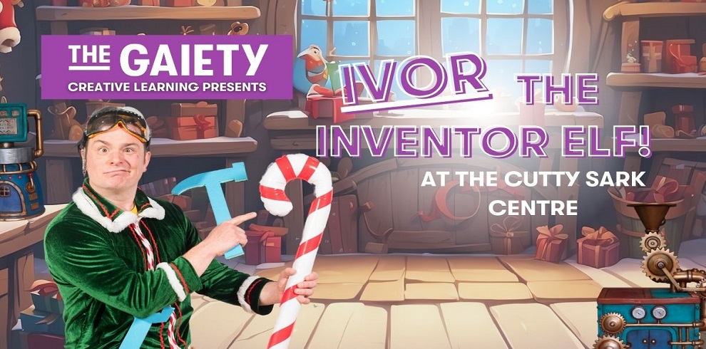 A promotional poster for 'Ivor the Inventor Elf!' presented by The Gaiety Creative Learning, located at the Cutty Sark Centre. The image features a festive workshop background with wooden shelves filled with toys and decorations. A cheerful person dressed as an elf in a green velvet outfit with white trim points to a large candy cane. They wear goggles on their head, emphasizing their inventor persona. The text appears in bold purple and white lettering overlaid on the image.