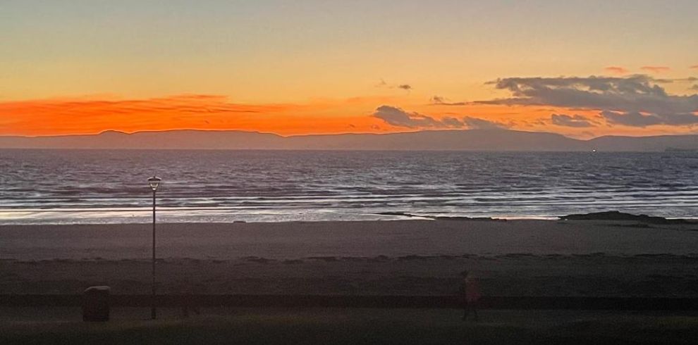 A view of the sunset down Ayr beach.