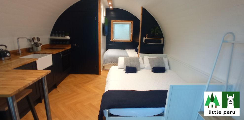 An image of a bedroom with 2 beds.