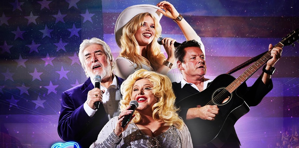 Four individuals performing on a stage with an American flag backdrop. One person wears a white cowboy hat and holds a microphone, another plays an acoustic guitar, and two others also hold microphones. Their faces are obscured by rectangular blocks. The stage lighting features vibrant purple and blue hues.
