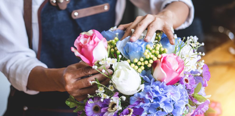 An image of a florist arranging flowers.