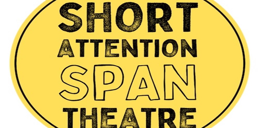 A circular yellow logo with a black outline contains bold, stylized text that reads: “SHORT ATTENTION SPAN THEATRE.” The word “SPAN” is larger and drawn in a looser, outlined font, contrasting with the solid black letters of the other words. The design has a playful, informal feel, suggesting humor or fast-paced content.
