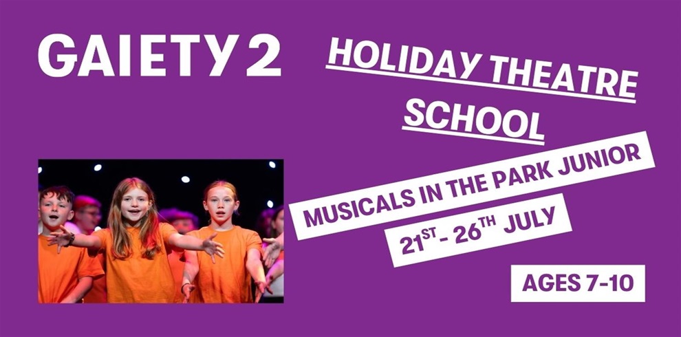 Promotional poster for "GAIETY 2 THEATRE MINIS SUMMER WORKSHOP" on a purple background. The theme for this session is "Musicals in the Park," scheduled for "Monday 21st July – Saturday 26th July." The workshop is for children aged 7-10. On the left side, there is a photo of young children wearing orange t-shirts on stage, actively participating with arms raised during a theatre activity.