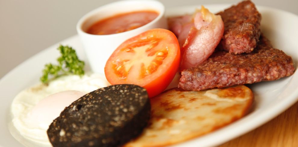 Delicious cooked Scottish breakfats on a plate.