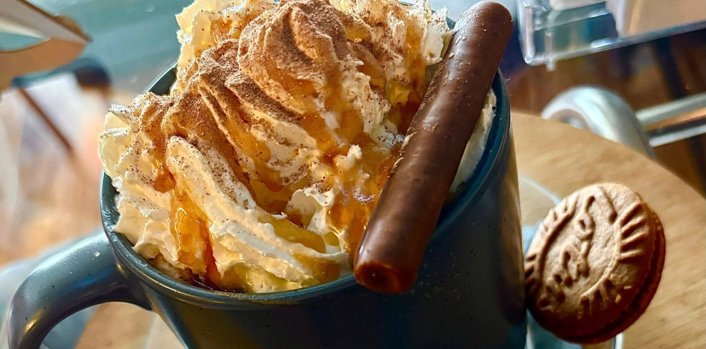 Creamy topped hot drink.