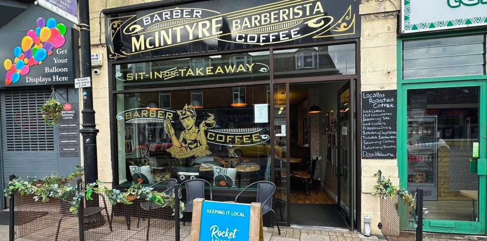 Exterior of barber and coffee shop.