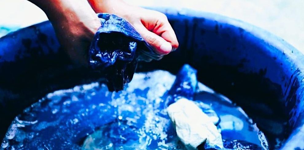 An image of dyeing of material process.
