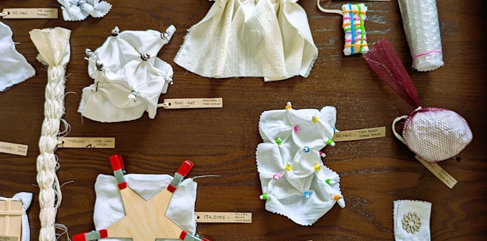 An image of pieces of material laid out on a table.